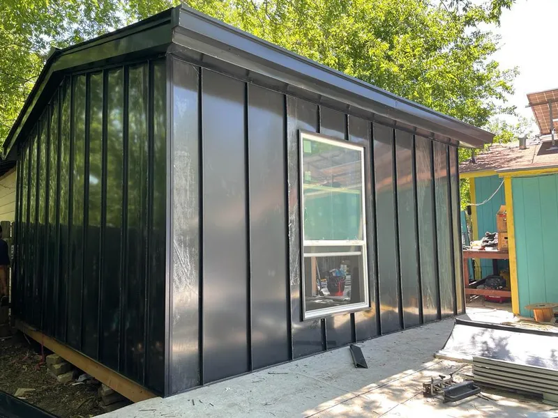 Black standing seam metal wall panels for Roof Inspection in Zimmerman